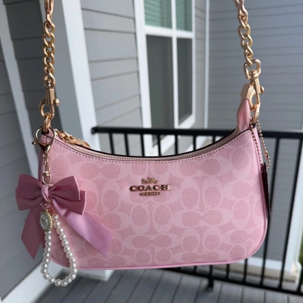COACH Pink Signature Canvas Bag.